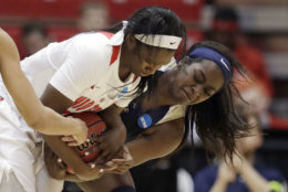 Ohio State's Linnae Harper, left, and George Washington's Neila Luma battle for the ball in the first half during a first-round game in the NCAA women's college basketball tournament Saturday, March 17, 2018, in Columbus, Ohio. (AP Photo/Tony Dejak)