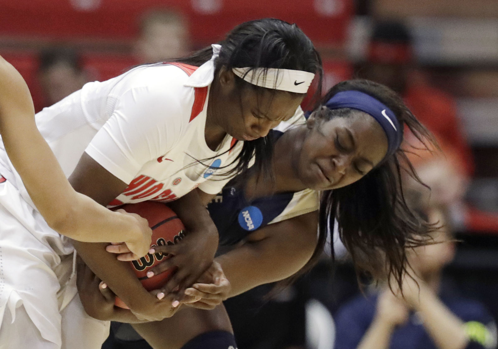 Ohio State's Linnae Harper, left, and George Washington's Neila Luma battle for the ball in the first half during a first-round game in the NCAA women's college basketball tournament Saturday, March 17, 2018, in Columbus, Ohio. (AP Photo/Tony Dejak)