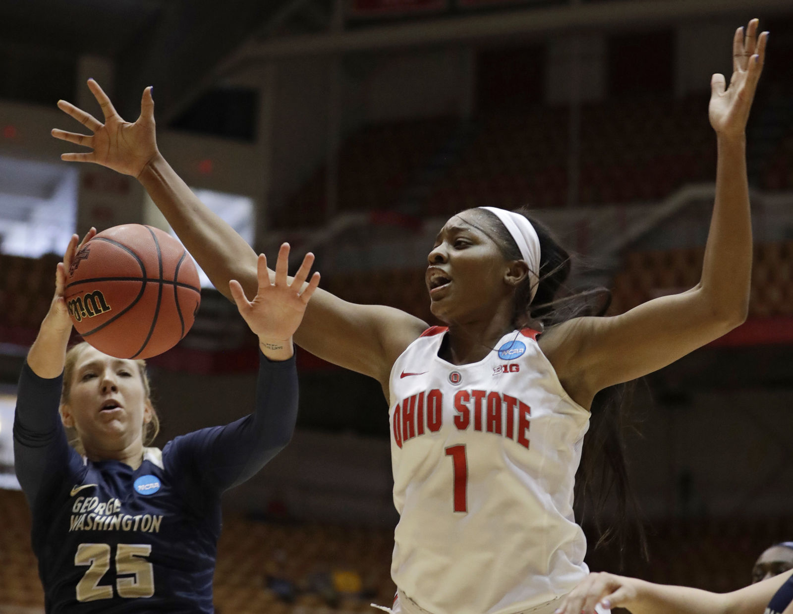 George Washington's Kelli Prange (25) and Ohio State's Stephanie Mavunga (1) battle for a loose ball in the first half during a first-round game in the NCAA women's college basketball tournament Saturday, March 17, 2018, in Columbus, Ohio. (AP Photo/Tony Dejak)