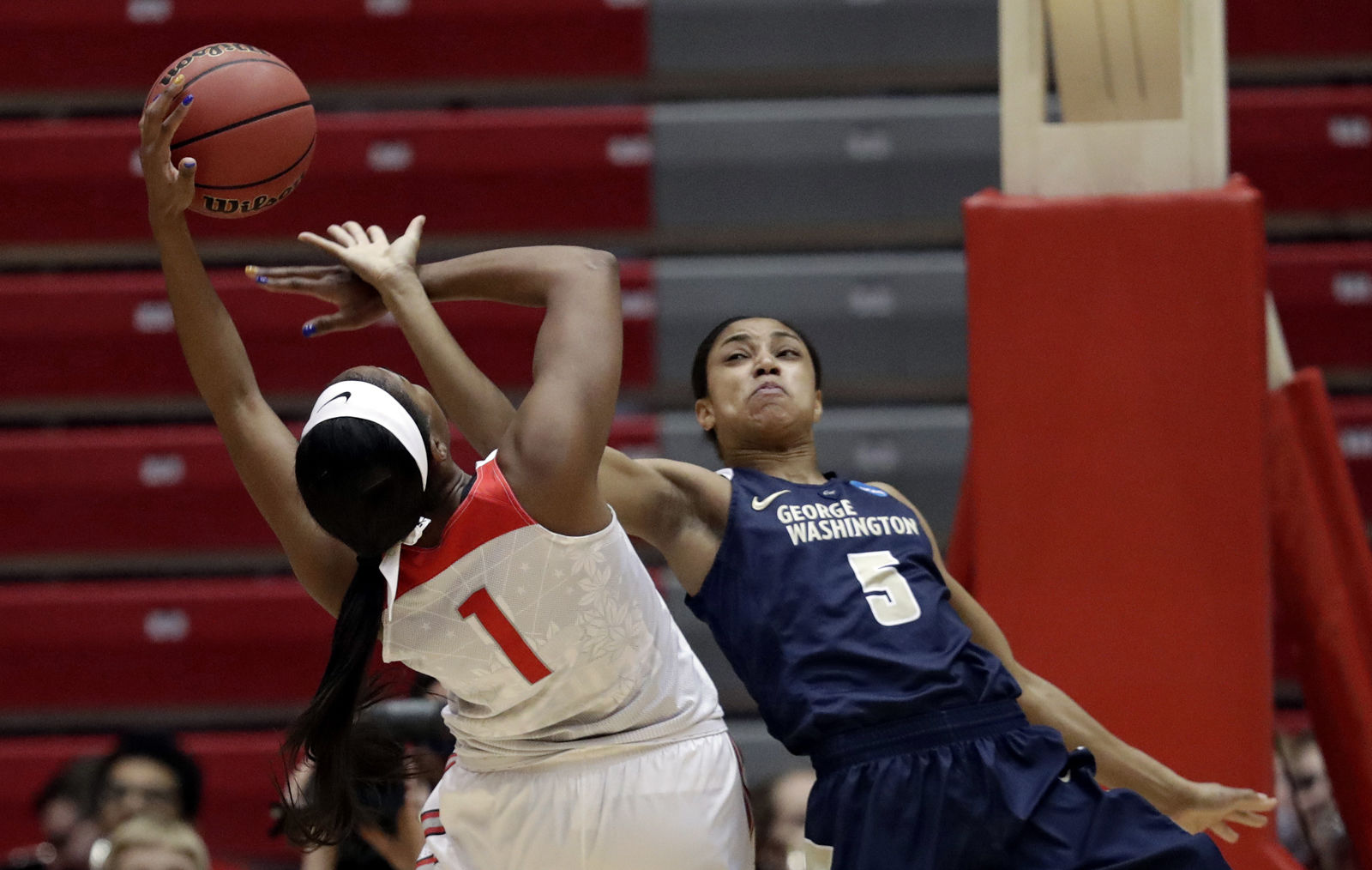 George Washington's Brianna Cummings (5) and Ohio State's Stephanie Mavunga (1) battle for a rebound in the first half during a first-round game in the NCAA women's college basketball tournament Saturday, March 17, 2018, in Columbus, Ohio. (AP Photo/Tony Dejak)