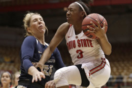 George Washington's Kelli Prange, left, fouls Ohio State Buckeyes' Kelsey Mitchell in the first half during a first-round game in the NCAA women's college basketball tournament Saturday, March 17, 2018, in Columbus, Ohio. (AP Photo/Tony Dejak)