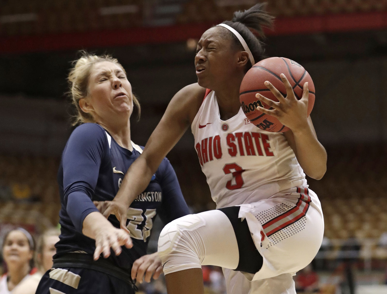 George Washington's Kelli Prange, left, fouls Ohio State Buckeyes' Kelsey Mitchell in the first half during a first-round game in the NCAA women's college basketball tournament Saturday, March 17, 2018, in Columbus, Ohio. (AP Photo/Tony Dejak)
