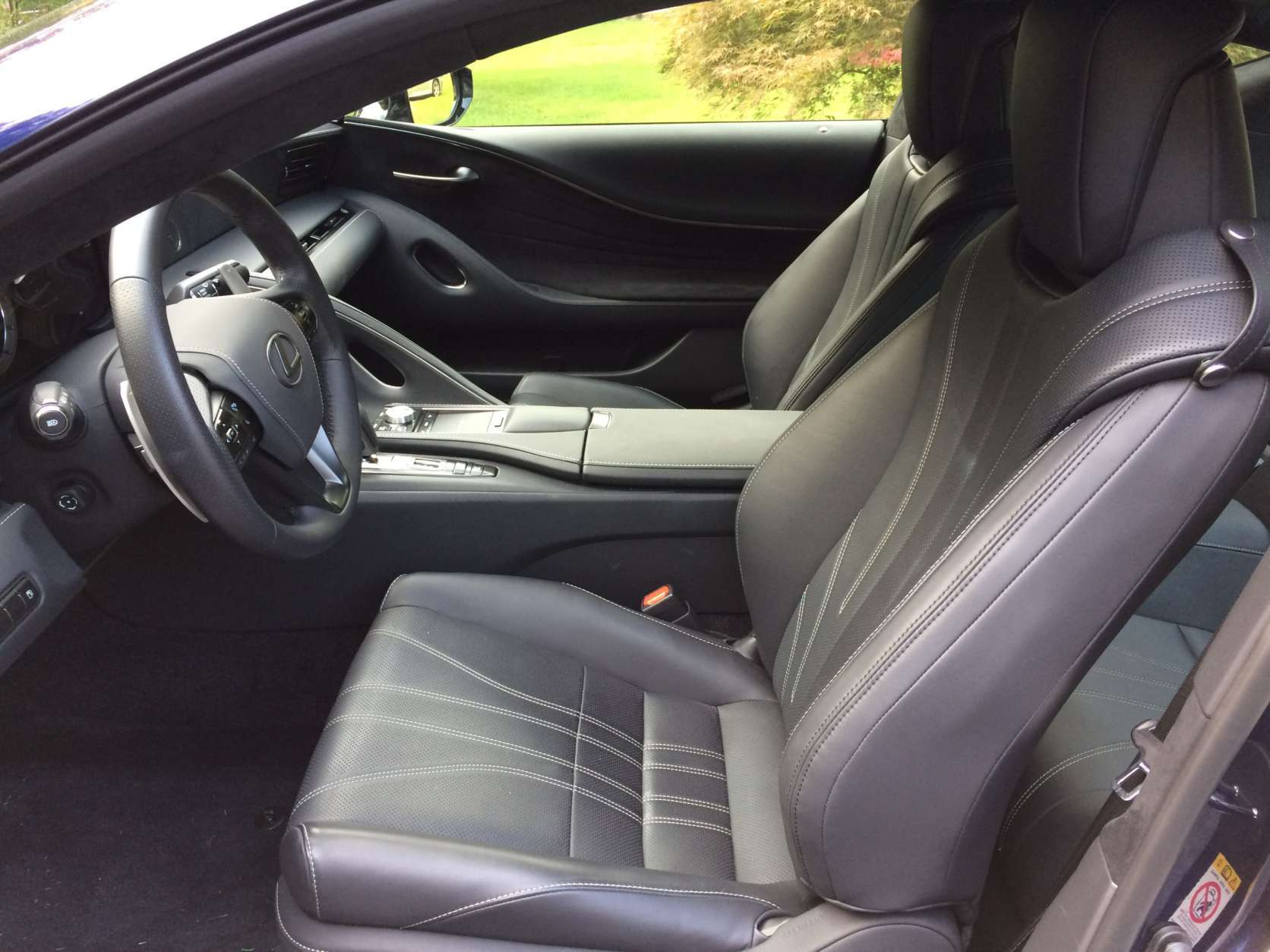 The leather seats have contrasting stitching in an interesting design that carries over on to the center console, arm rest, steering wheel and dash. Space in the front seats should fit most people without problems. (WTOP/Mike Parris) 