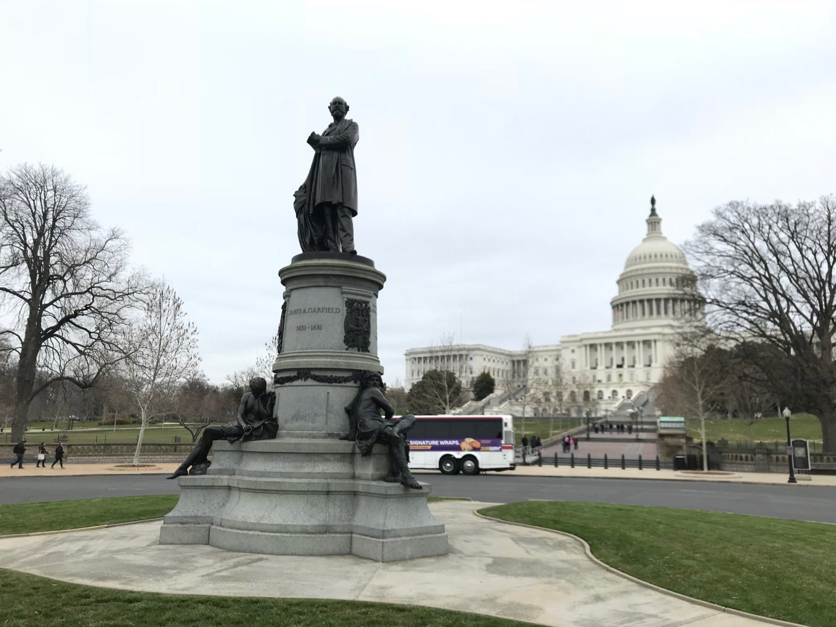 A statue of President James Garfield sits at the foot of the U.S. Capitol near the U.S. Botanic Garden. (WTOP/Dick Uliano)