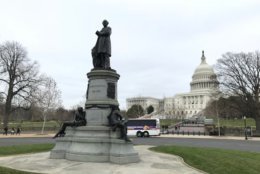 A statue of President James Garfield sits at the foot of the U.S. Capitol near the U.S. Botanic Garden. (WTOP/Dick Uliano)