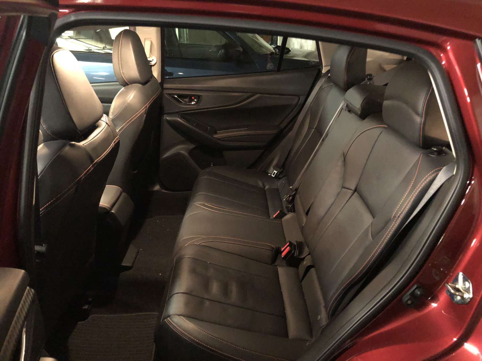 The orange stitching on the seats, steering wheel and throughout the interior adds a bit of color and pop inside. Space is good for this class with decent head and legroom both up front and in the rear seats; it has more space in the back than before. It is lacking vents for rear seat passengers. (WTOP/Mike Parris) 