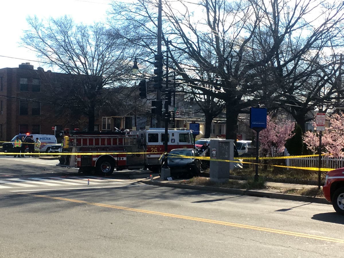 A driver was killed and two others, including a pregnant woman, were taken to a hospital after a D.C. Fire and EMS truck collided with a car in Northeast on Friday afternoon. (WTOP/Mike Murillo)