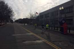 Rock 'n' Roll Marathon runners race down the street in Washington. (WTOP/John Domen)