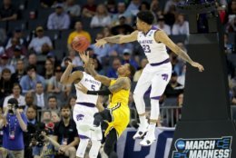 CHARLOTTE, NC - MARCH 18:  Jairus Lyles #10 of the UMBC Retrievers fights for possession against the Kansas State Wildcats during the second round of the 2018 NCAA Men's Basketball Tournament at Spectrum Center on March 18, 2018 in Charlotte, North Carolina.  (Photo by Streeter Lecka/Getty Images)