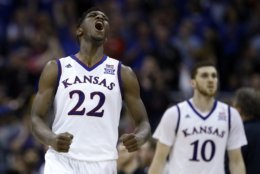 Kansas' Silvio De Sousa (22) celebrates during the second half of the NCAA college basketball championship game against West Virginia in the Big 12 men's tournament Saturday, March 10, 2018, in Kansas City, Mo. Kansas won 81-70. (AP Photo/Charlie Riedel)
