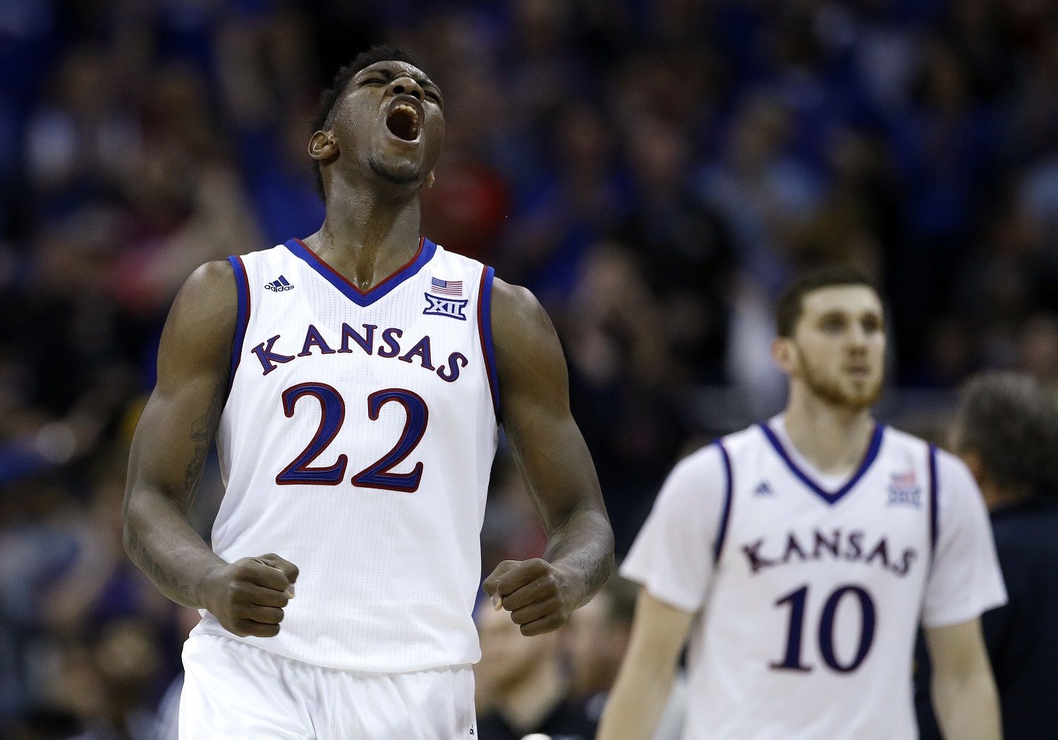 Kansas' Silvio De Sousa (22) celebrates during the second half of the NCAA college basketball championship game against West Virginia in the Big 12 men's tournament Saturday, March 10, 2018, in Kansas City, Mo. Kansas won 81-70. (AP Photo/Charlie Riedel)