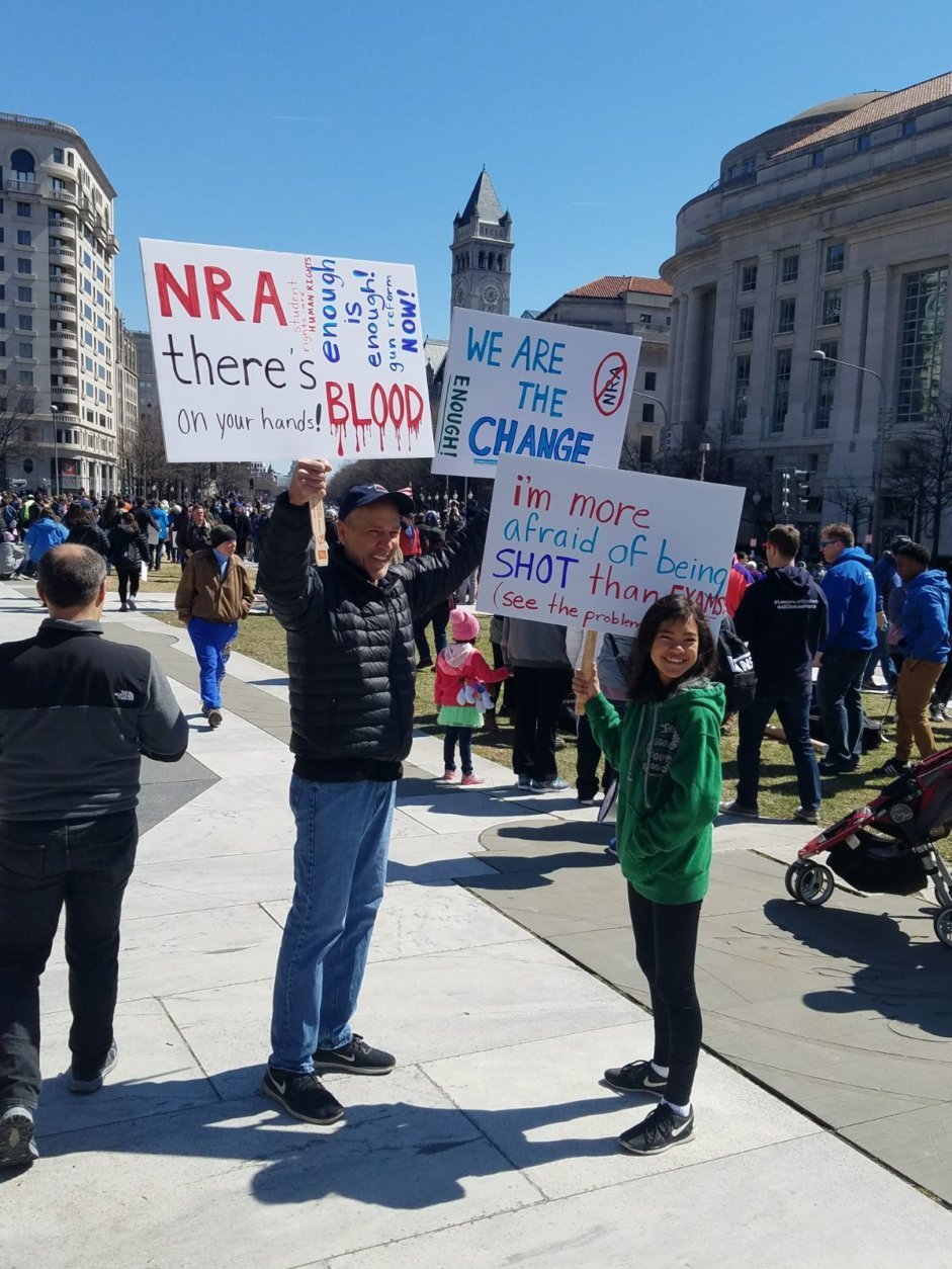 Protesters holding signs at Saturday's March For Our Lives Rally. (Courtesy Olivia Prieto)
