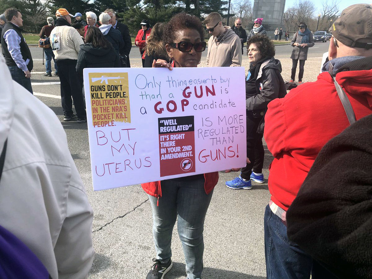 WTOP's Melissa Howell captured a woman holding a sign during Saturday's March For Our Lives rally. (WTOP/Melissa Howell) 