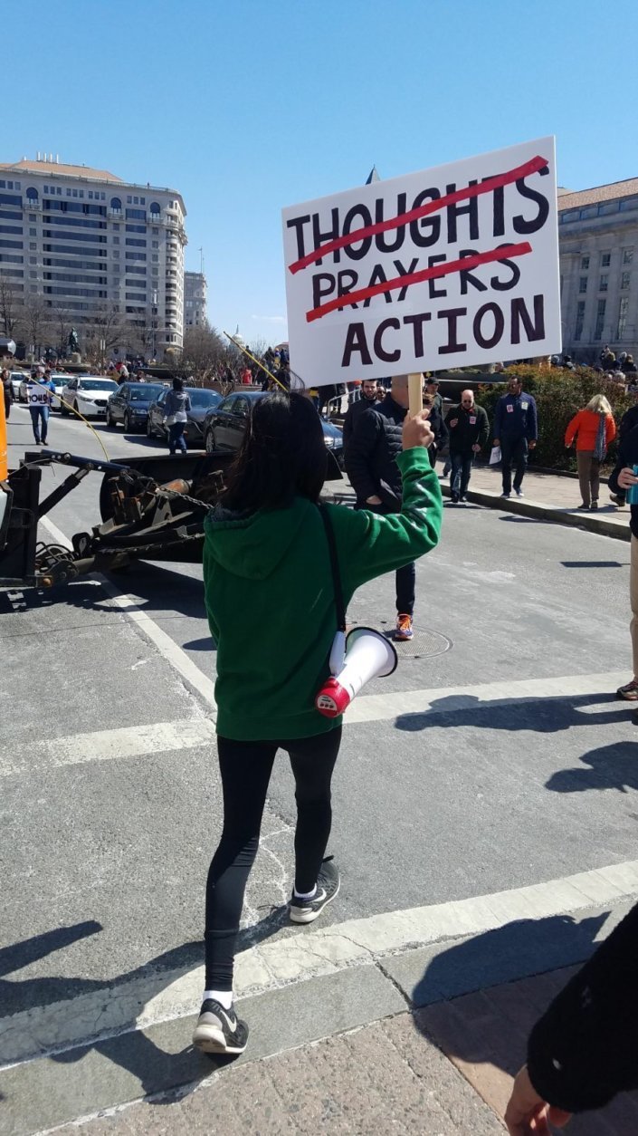 A protester holding a sign at Saturday's March For Our Lives rally. (Courtesy Olivia Prieto)
