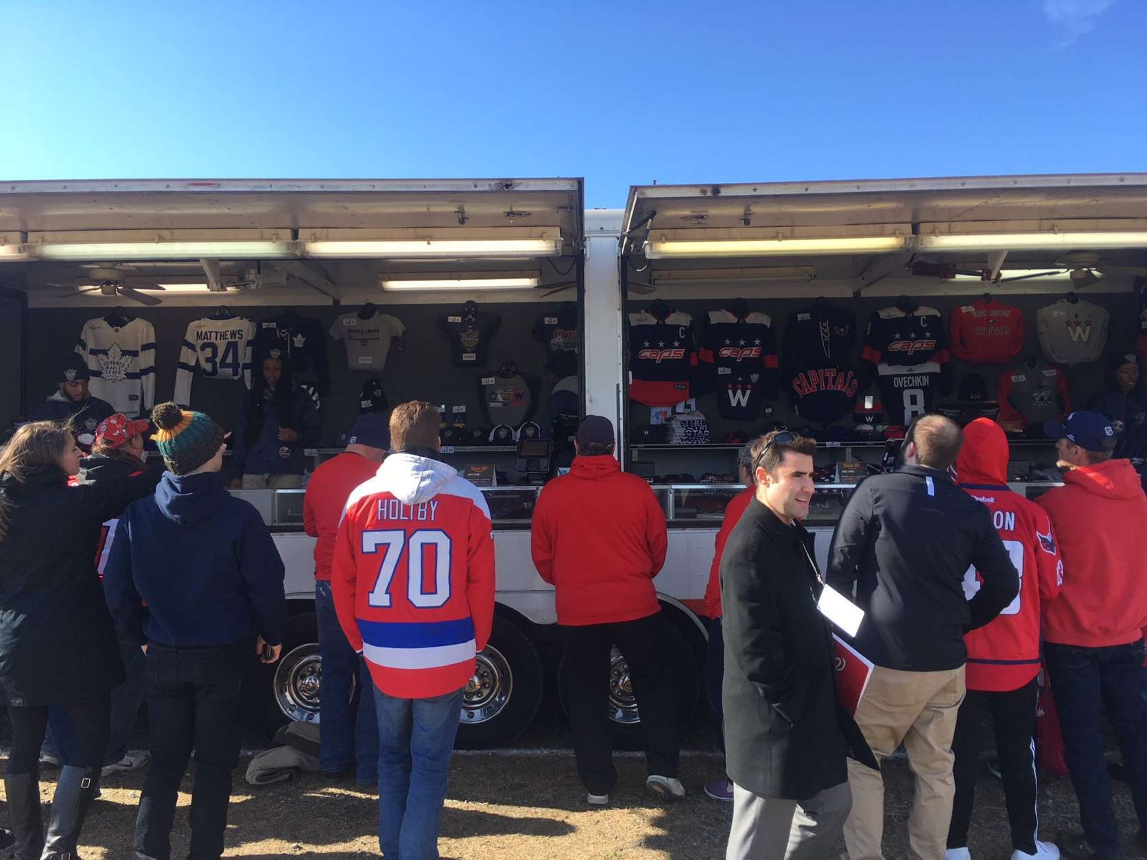 The merchandise van outside the PreGame, which opened a full six hours before the puck dropped (yes, that's WTOP's own Ben Raby photobombing in the right-center of the frame). (WTOP/Noah Frank)