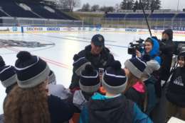 Mike Craig, NHL senior manager of facility operations in charge of the ice, surprised students visiting from nearby Germantown Elementary School as part of the Hockey Scholar STEM program with tickets to Saturday's game. (WTOP/Noah Frank)