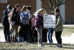 Students hold a sign during a student walkout outside Perry Hall High School in Perry Hall, Md., Wednesday, March 14, 2018. Students across the country planned to participate in walkouts Wednesday to protest gun violence, one month after the deadly shooting inside a high school in Parkland, Fla. (AP Photo/Patrick Semansky)