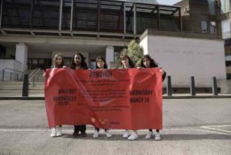 Students, aged 17 &amp; 18, pose for photographs with a banner outside the front of the American School in London, after taking part in a 10am local-time, 17-minute walkout in the school playground, which was attended by approximately 300 students aged 14-18, Wednesday, March 14, 2018. From Maine to Hawaii, students planned to walk out of school Wednesday to protest gun violence in the biggest demonstration yet of the student activism that has emerged in response to last month's massacre of 17 people at Florida's Marjory Stoneman Douglas High School. (AP Photo/Matt Dunham)