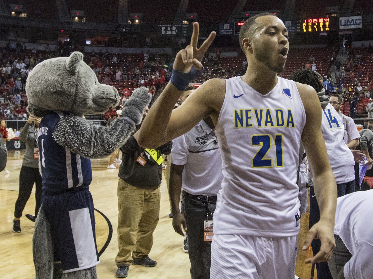 Nevada guard Kendall Stephens (21) celebrates with the fans after his team wins 79-74 over UNLV  following the second half of an NCAA college basketball quarterfinals game in the Mountain West Conference tournament, Thursday, March 8, 2018, in Las Vegas. (AP Photo/L.E. Baskow)