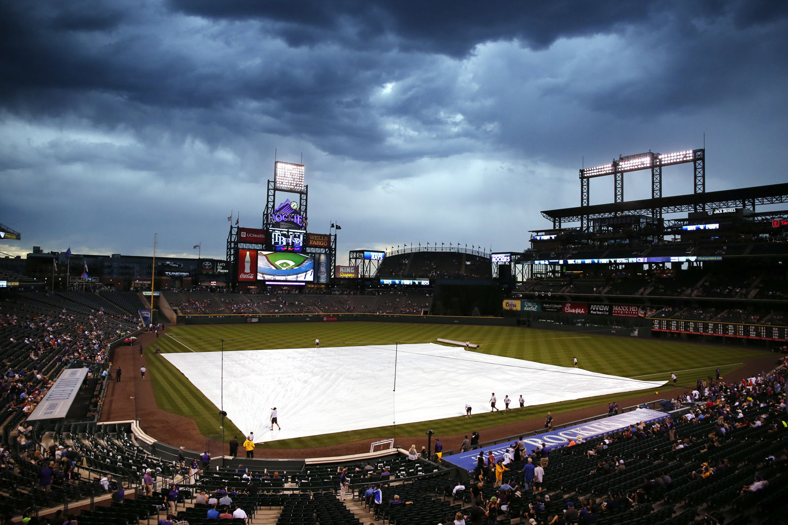 Coors Field, the home of the Colorado Rockies, is the cheapest stadium to watch a ballgame. The average cost to attend a game, plus food, beer and parking is $50. File. (AP Photo/Jack Dempsey)