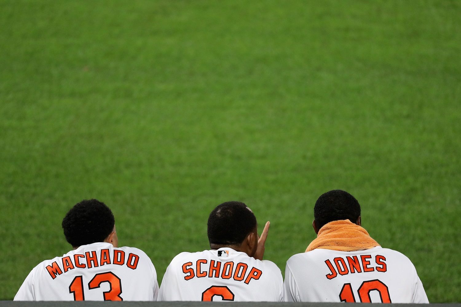 Manny Machado, Jonathan Schoop, and Adam Jones by Rob Carr