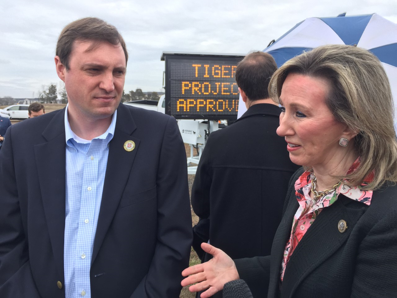 Loudoun County Supervisor Matthew F. Letourneau talks with Rep. Barbara Comstock (a Republican representing Virginia's 10th District), who helped the county's efforts when applying for the federal transportation grant. (WTOP/Kristi King)