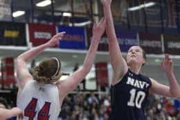 Navy forward Laurel Jaunich (10) battles for the ball against American forward Cecily Carl (44) during the first half an NCAA college basketball game for the Patriot League women's tournament championship, Sunday, March 11, 2018, in Washington. (AP Photo/Nick Wass)