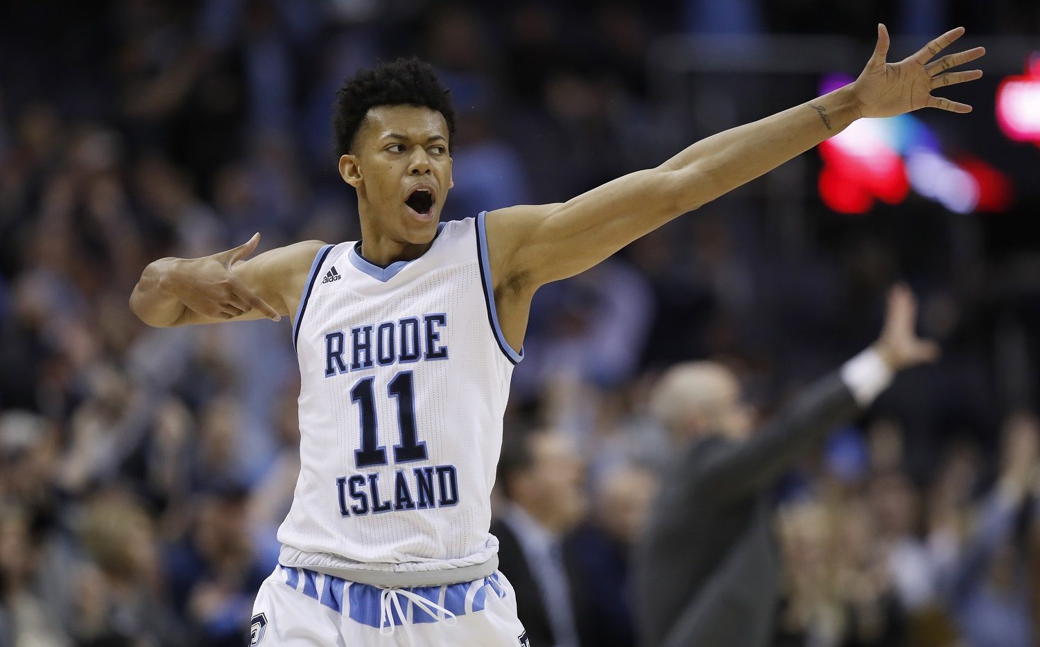 Rhode Island guard Jeff Dowtin celebrates his 3-point shot during the second half of an NCAA college basketball game against Saint Joseph's in the semifinals of the Atlantic 10 Conference tournament, Saturday, March 10, 2018, in Washington. Rhode Island won 90-87. (AP Photo/Alex Brandon)