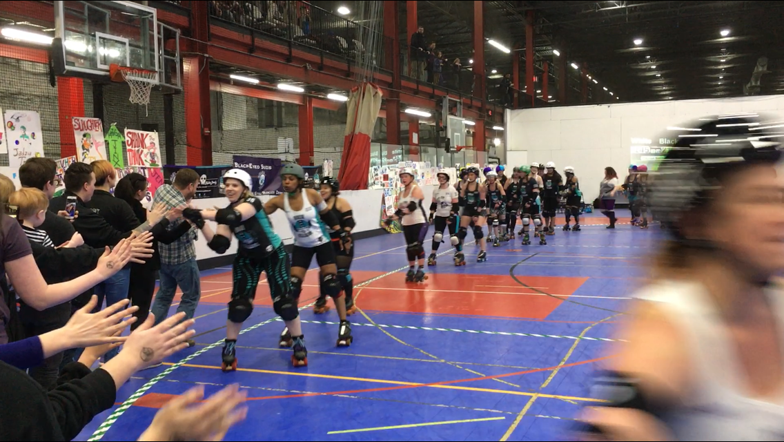 On Sunday, the Free State Roller Derby league pit their travel teams, The Black Eyed Suzies and Rock Villains, against each other in a friendly season-opening bout in Rockville’s Sportsplex. (WTOP/Liz Anderson) 