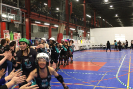On Sunday, the Free State Roller Derby league pit their travel teams, The Black Eyed Suzies and Rock Villains, against each other in a friendly season-opening bout in Rockville’s Sportsplex. (WTOP/Liz Anderson) 