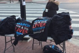 Outside Gallery Place just after 8 a.m., shirts are already being sold. (WTOP/John Domen)