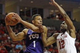 TCU's Desmond Bane (1) tries to pass the ball around Texas Tech's Keenan Evans (12) during the first half of an NCAA college basketball game against Texas Tech, Saturday, March 3, 2018 in Lubbock, Texas. (AP Photo/Brad Tollefson)