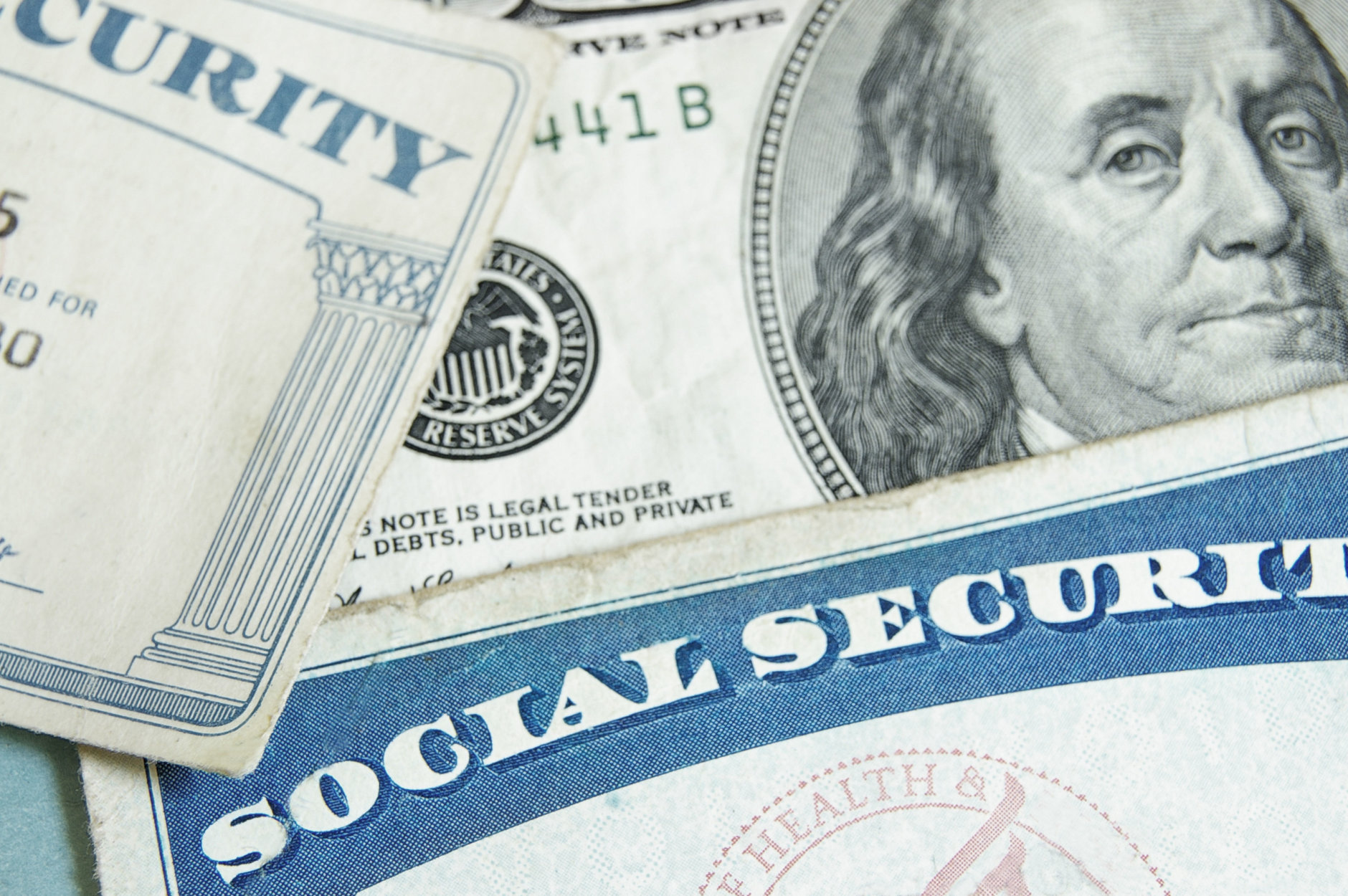 Social security cards and U.S. money - retirement concept. (Thinkstock)