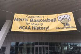 The banner outside the UMBC event center, welcoming the team and students for a celebration Tuesday. (WTOP/Noah Frank)