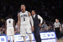 Providence head coach Ed Cooley, right, and Villanova's Jalen Brunson (1) react after Brunson made a three point basket during the second half of an NCAA college basketball game in the Big East men's tournament finals Saturday, March 10, 2018, in New York. (AP Photo/Frank Franklin II)