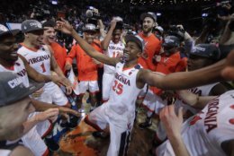 Virginia players celebrate after defeating North Carolina in the championship game of the NCAA Atlantic Coast Conference men's college basketball tournament, Saturday, March 10, 2018, in New York. (AP Photo/Julie Jacobson)