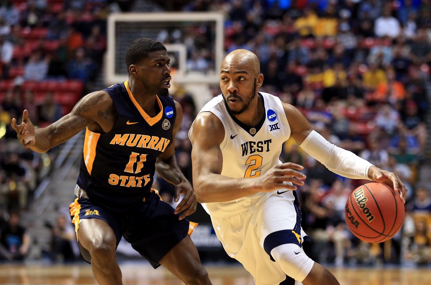 SAN DIEGO, CA - MARCH 16:  Jevon Carter #2 of the West Virginia Mountaineers handles the ball against Shaq Buchanan #11 of the Murray State Racers in the first half during the first round of the 2018 NCAA Men's Basketball Tournament at Viejas Arena on March 16, 2018 in San Diego, California.  (Photo by Sean M. Haffey/Getty Images)