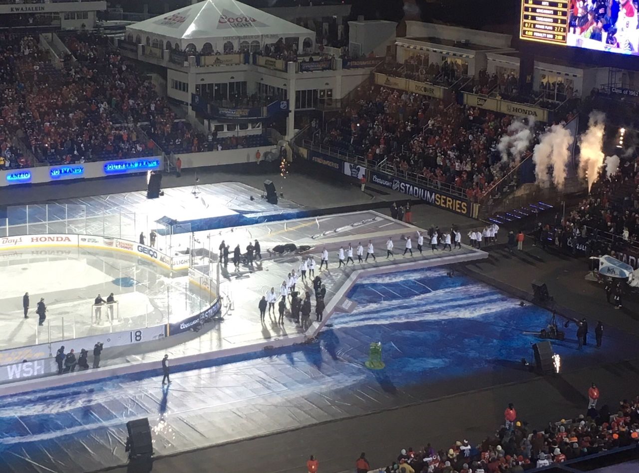 The U.S. Women's Hockey Team is honored on ice during he second intermission at Saturday's NHL Stadium Series game. (WTOP/Noah Frank)