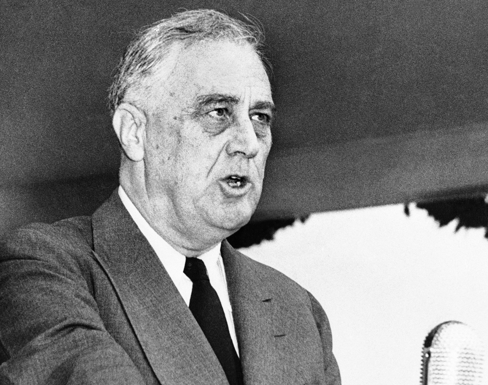 FILE - In this April 13, 1943 black-and-white file photo, President Franklin Delano Roosevelt speaks in Washington. When President Barack Obama's re-election campaign unveiled a new slogan, some conservative critics were quick to pounce. "Forward", they asserted, is a word long associated with Europe's radical left, reaffirming their contention that Obama is, to some degree a socialist. Using "socialist" as a political epithet in the U.S. dates back to pre-Civil War days when abolitionist newspaper editor Horace Greeley was branded a socialist by some pro-slavery adversaries. Decades later, many elements of Franklin Roosevelt's New Deal _ including Social Security _ were denounced as socialist. (AP Photo/Robert Clover, File)