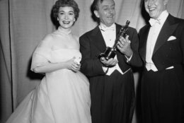 Walt Disney (center) receives Academy Award for best two-reel short subjects, Water Birds from Jane Wyman and Ray Milland, right, at the 1953 Academy Awards presentation in Hollywood on March 19, 1953. (AP Photo)