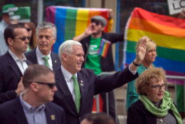 Vice President Mike Pence, center, his wife Karen Pence, left, and his mother Nancy Pence Fritch, right, march in the St. Patrick's Day parade Saturday, March 17, 2018, in Savannah, Ga.  Irish immigrants to Savannah and their descendants have been celebrating St. Patrick's Day with a parade since 1824. (AP Photo/Stephen B. Morton)