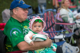 Seven-month-old Lily Kangetter of Savannah sits with her grandfather Pat Sullivan before the start of the St. Patrick's Day parade. (AP Photo/Stephen B. Morton)