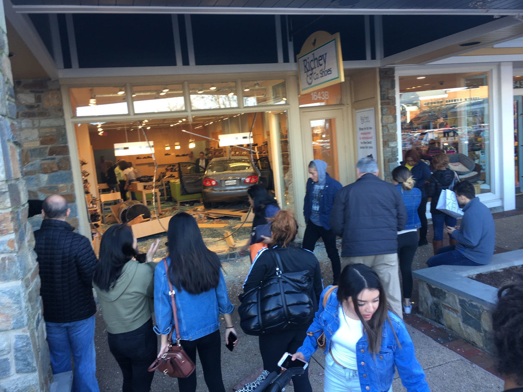 Shoppers gather to see a car that crashed into a store in Rockville, Maryland. (Courtesy Dave Kremnitzer)