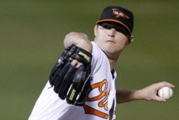 Baltimore Orioles pitcher Zach Britton throws in the second inning during a spring training baseball game against the New York Yankees in Sarasota, Fla., Monday, March 7, 2011.  (AP Photo/Gene J. Puskar)