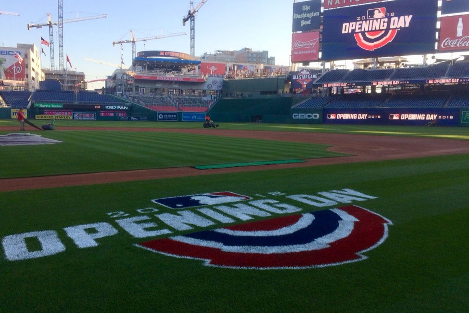 Workers prepare the field at Nationals Park Thursday ahead of the home opener. (WTOP/Nick Iannelli)