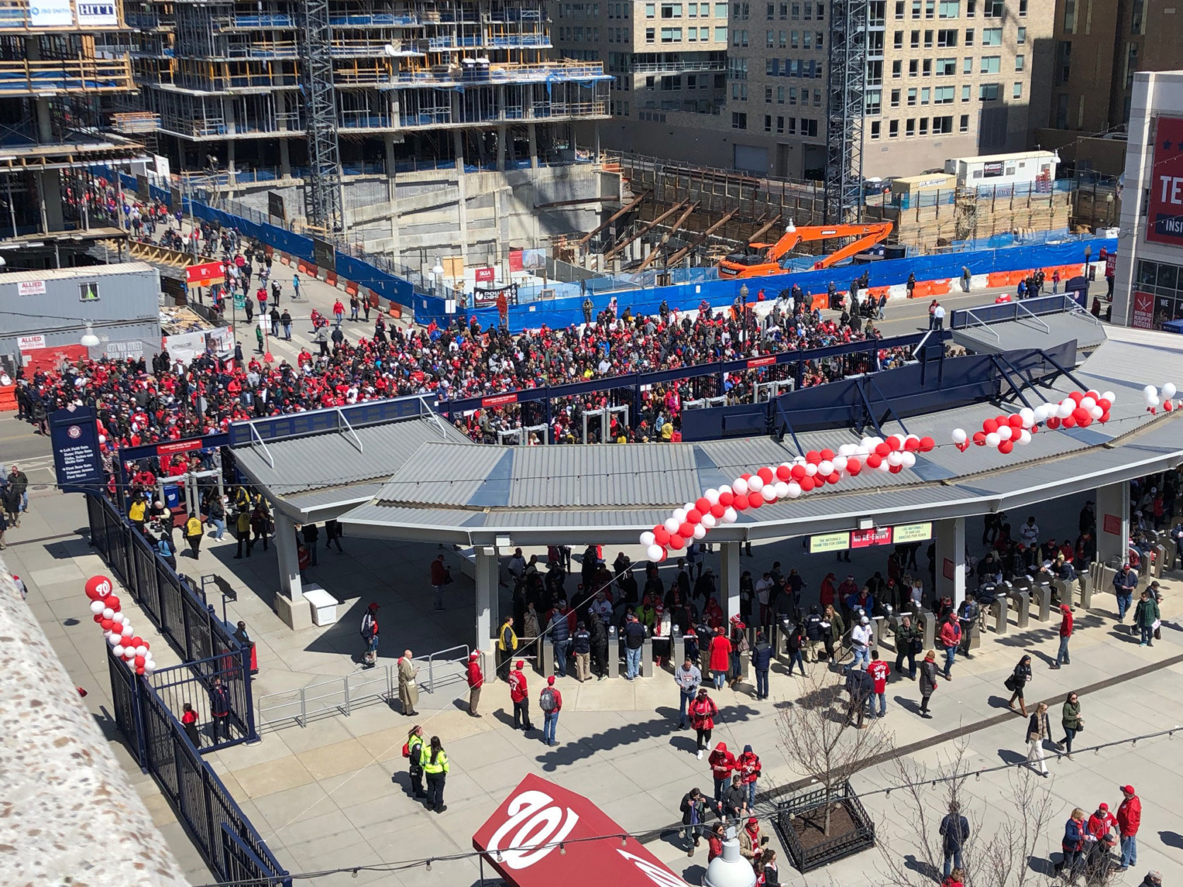Huge crowds of fans gather at the gates to Nationals Park for opening day in April 2018. (WTOP/Julia Ziegler)
