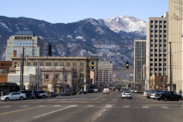 Downtown Colorado Springs Colorado looking west from Pikes Peak Avenue towards Pikes Peak and the Rocky Mountains.