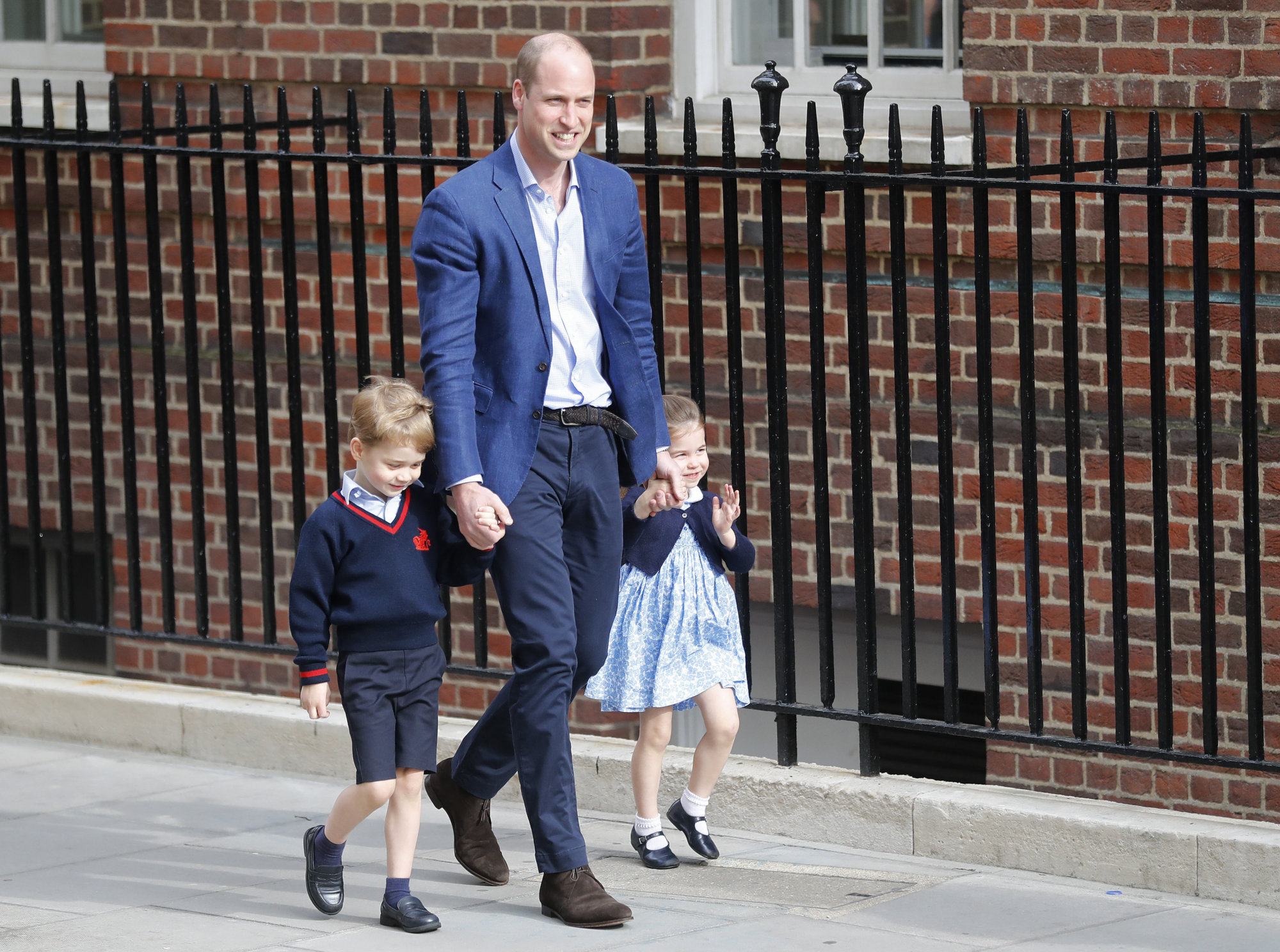 Britain's Prince William arrives with Prince George and Princess Charlotte back to the Lindo wing at St Mary's Hospital in London London, Monday, April 23, 2018. The Duchess of Cambridge gave birth Monday to a healthy baby boy — a third child for Kate and Prince William and fifth in line to the British throne. (AP Photo/Frank Augstein)
