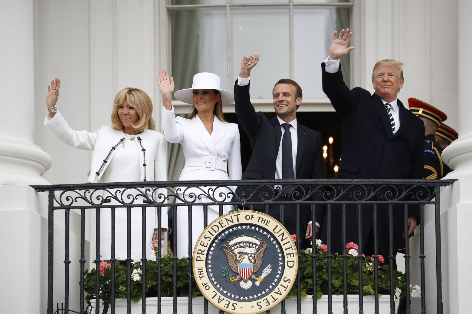 President Donald Trump, French President Emmanuel Macron, first lady Melania Trump and Brigitte Macron wave from the White House balcony during a State Arrival Ceremony at the White House in Washington, Tuesday, April 24, 2018. (AP Photo/Pablo Martinez Monsivais)