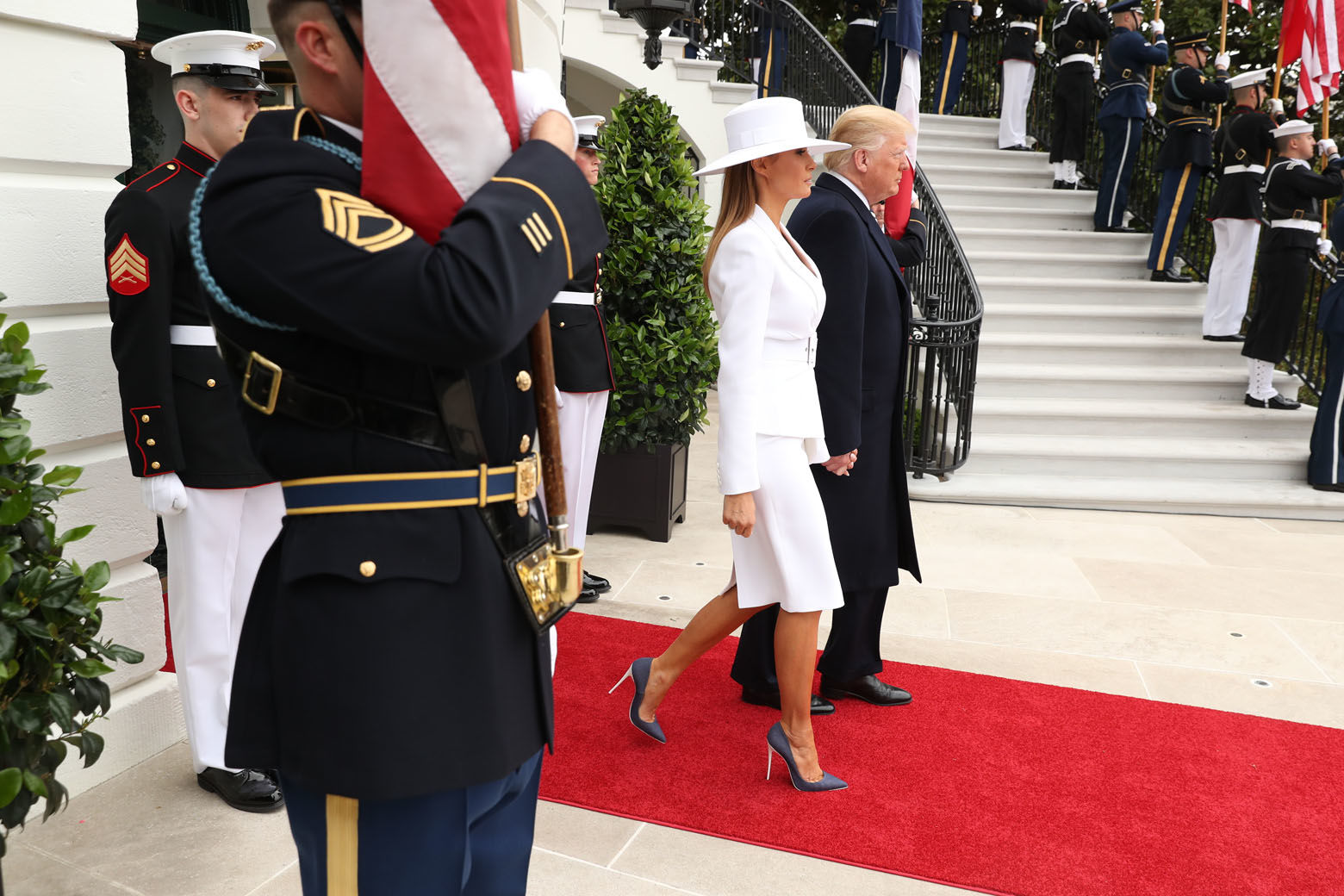President Donald Trump and first lady Melania Trump walk out of the White House at the beginning of a State Arrival Ceremony on the South Lawn of the White House in Washington, Tuesday, April 24, 2018.   Praising the strength of America's oldest alliance, Trump welcomed French President Emmanuel Macron to the White House Tuesday with a pomp-filled ceremony on the South Lawn. (AP Photo/Pablo Martinez Monsivais)